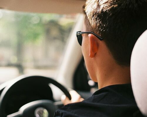 adult-back-view-car-daytime